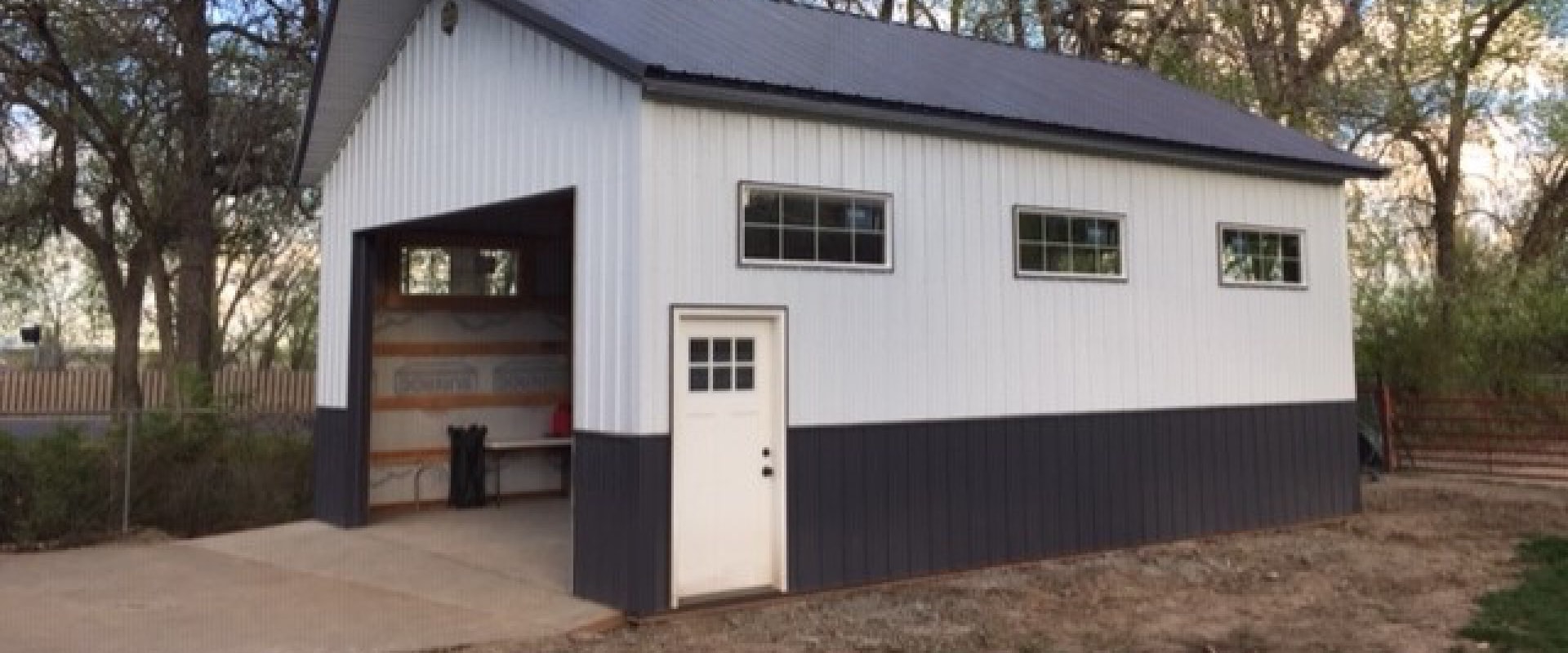 Is it cheaper to build a wood barn or metal?